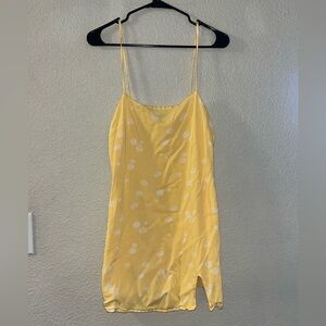 KENDALL + KYLIE Yellow and white floral mini dress with adjustable straps.